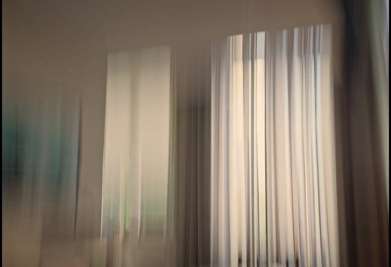 a blurry photo of a room with curtains