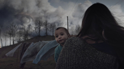 a woman holding a baby in her arms