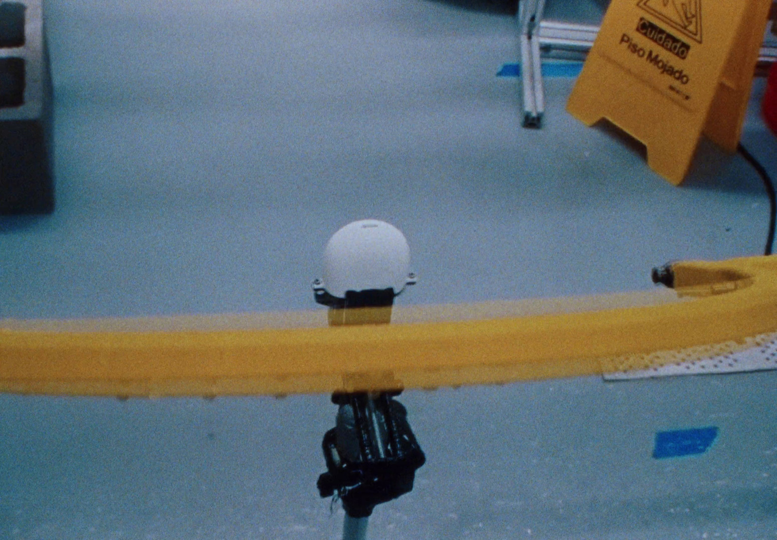 a white helmet on top of a yellow object