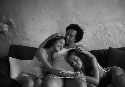 a group of women sitting on top of a couch