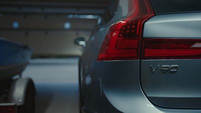 two cars parked in a parking garage next to each other