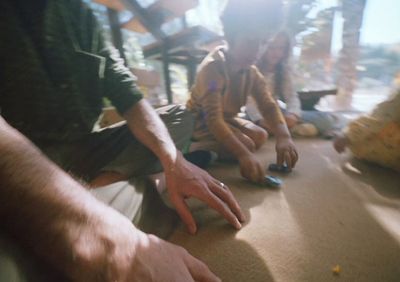 a group of people sitting on the floor next to each other