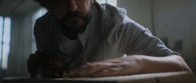 a man sitting at a table in a room