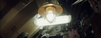 a light hanging from a ceiling in a room