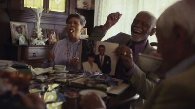 a group of people sitting around a table