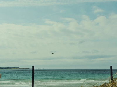 a view of the ocean from a beach