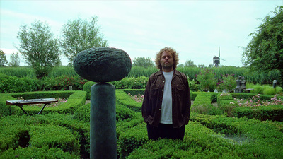 a man standing in the middle of a maze