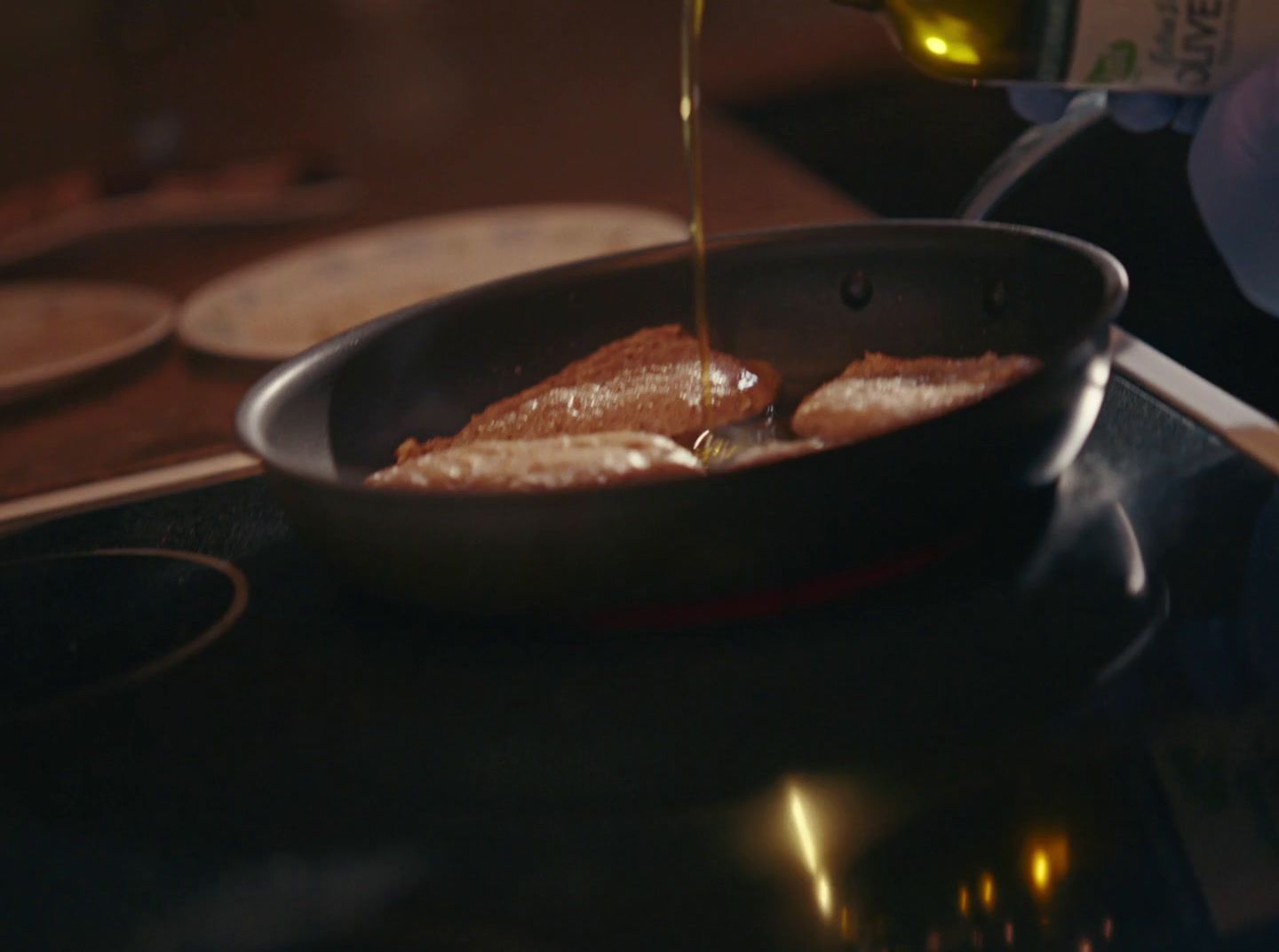 a pan filled with food sitting on top of a stove