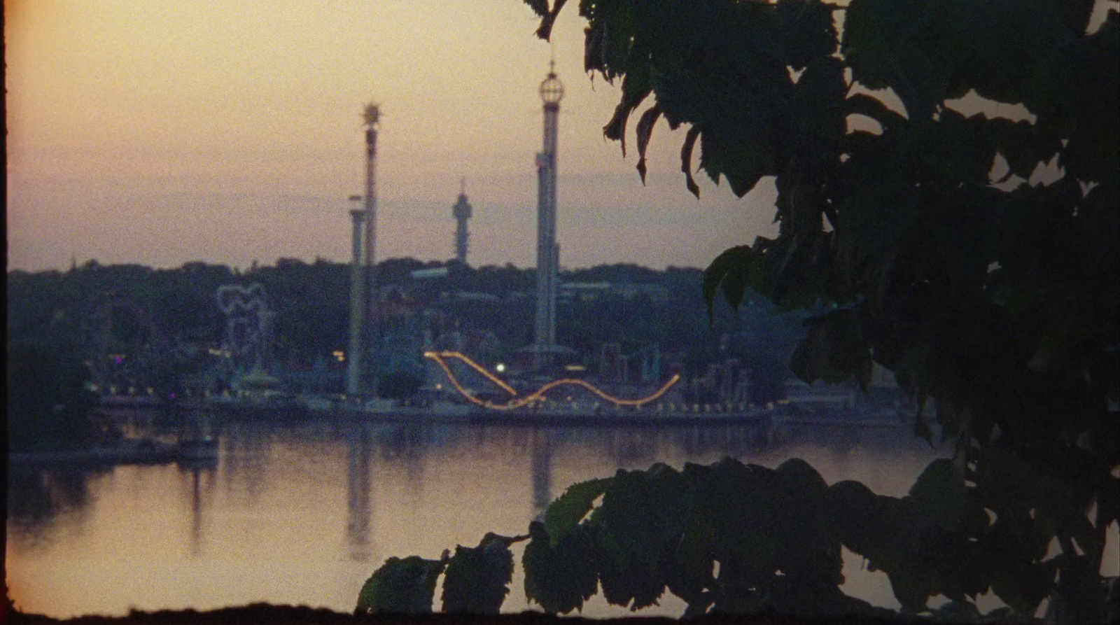 a large body of water with a clock tower in the background