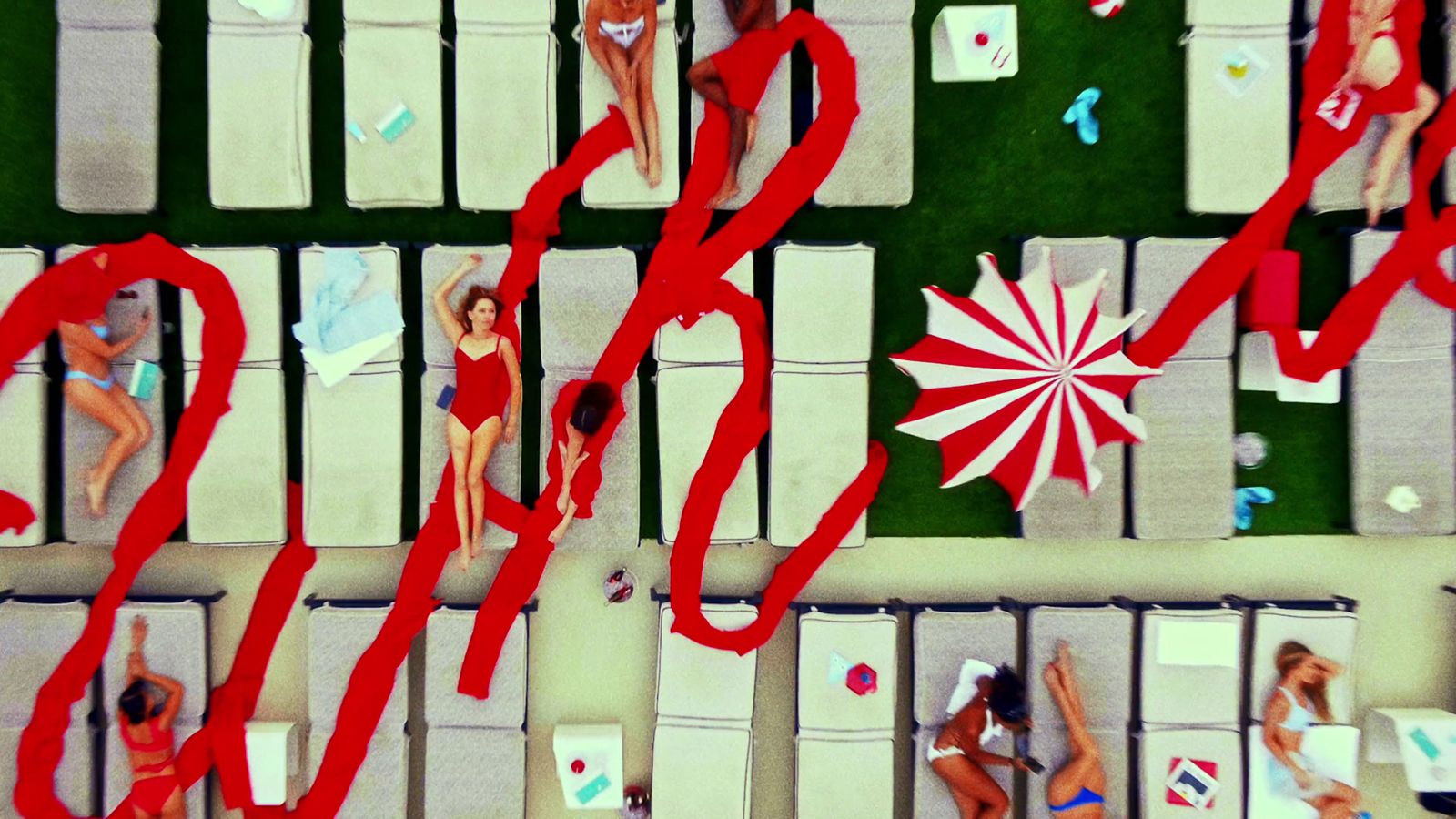 a group of women in bathing suits standing next to each other