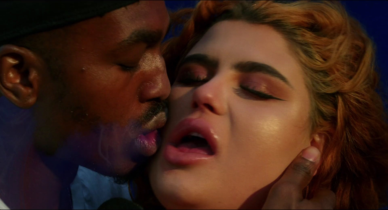 a close up of a person kissing a person