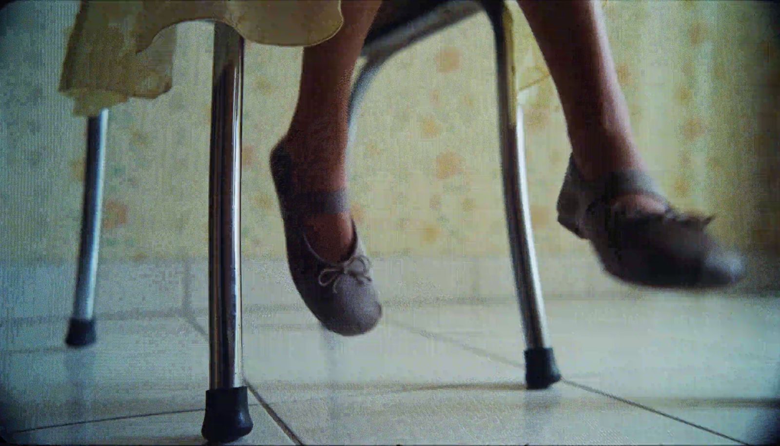 a woman's legs and feet with shoes on them