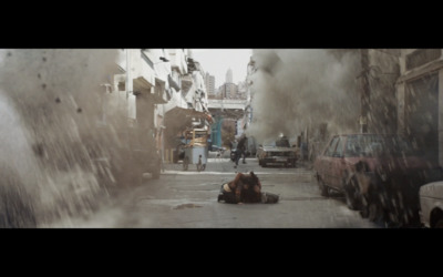 a person laying on the ground in a dirty street