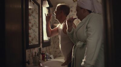 a woman brushing her teeth in a bathroom