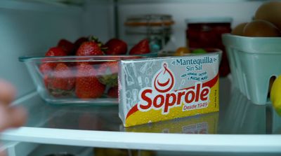 a carton of soppole sitting on top of a refrigerator