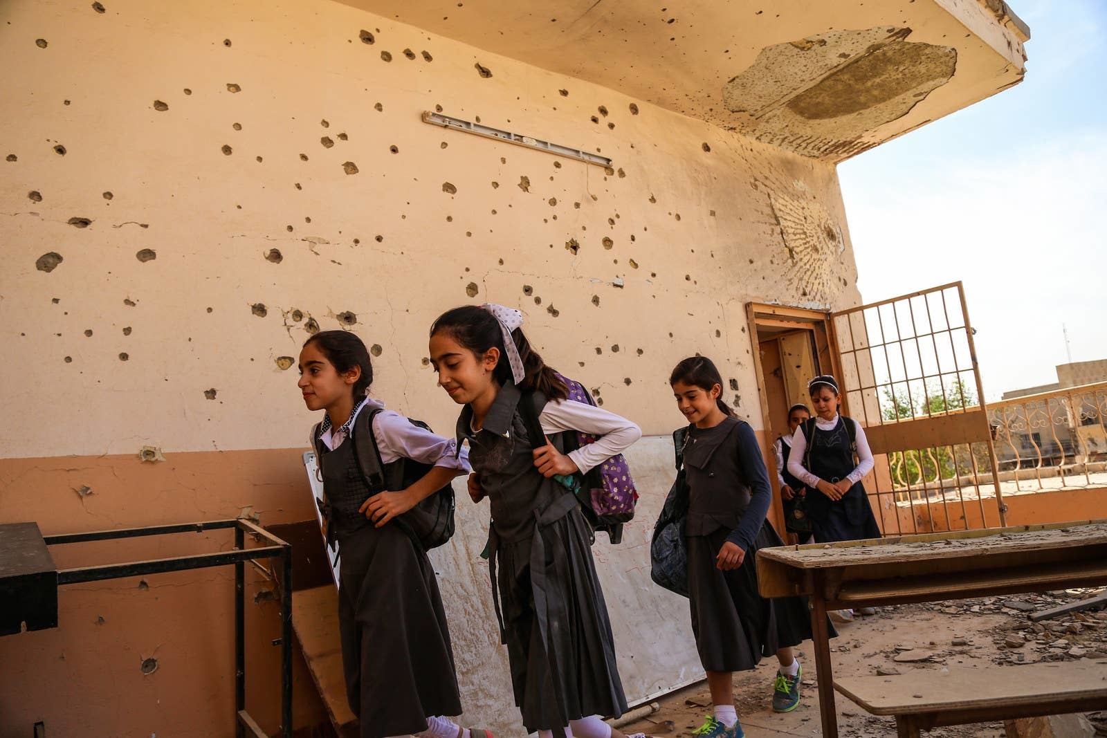 a group of young girls standing next to each other