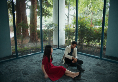 a man and a woman sitting on the ground