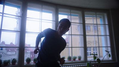 a man is standing in front of a window