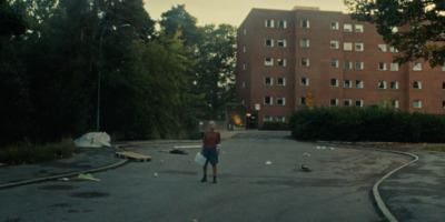 a person standing in the middle of a road