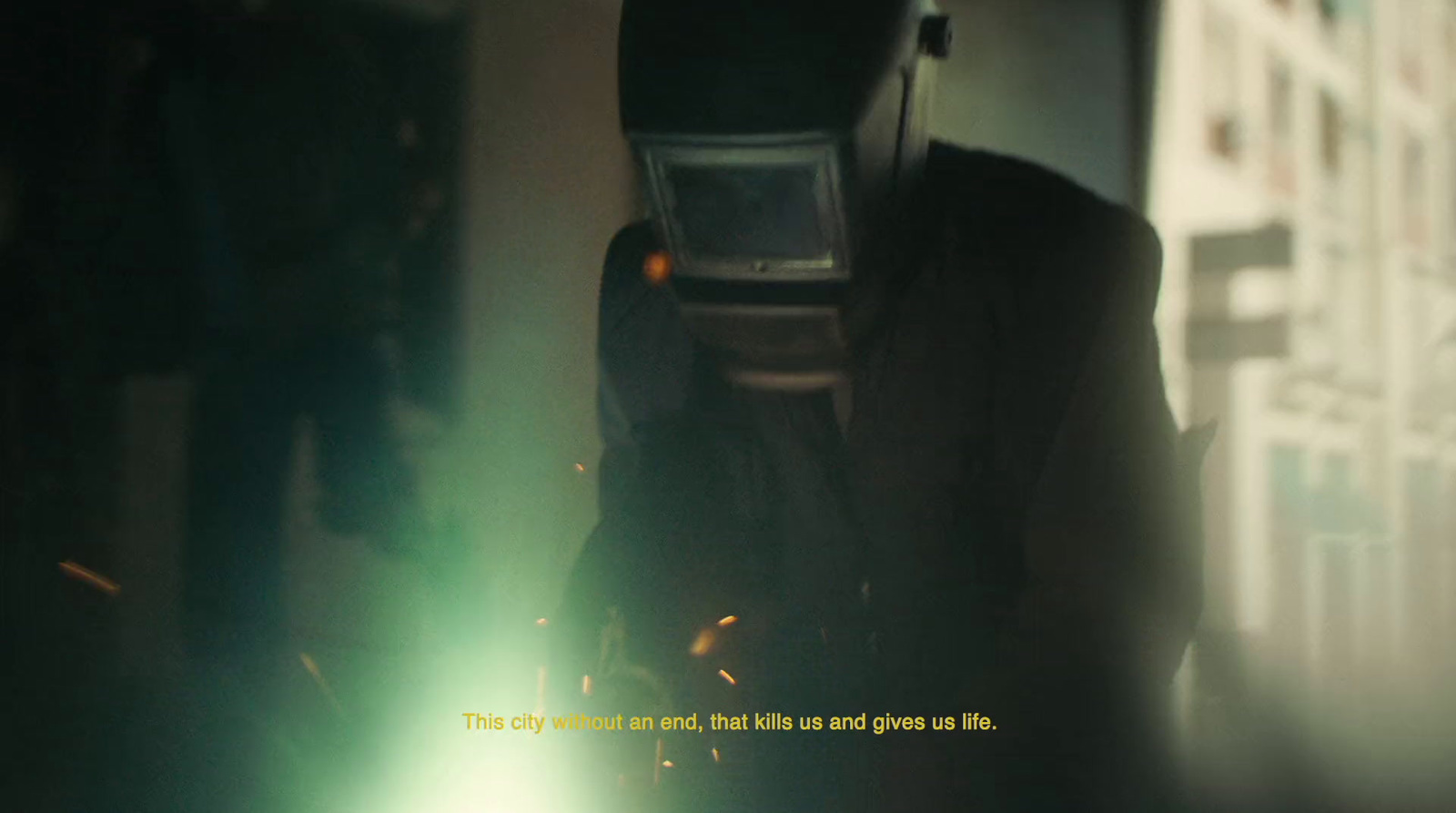 a man in a suit and welding mask