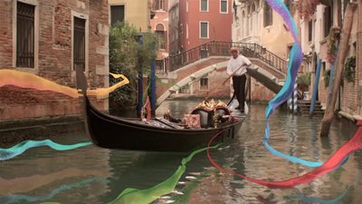 a man standing on a boat in a canal