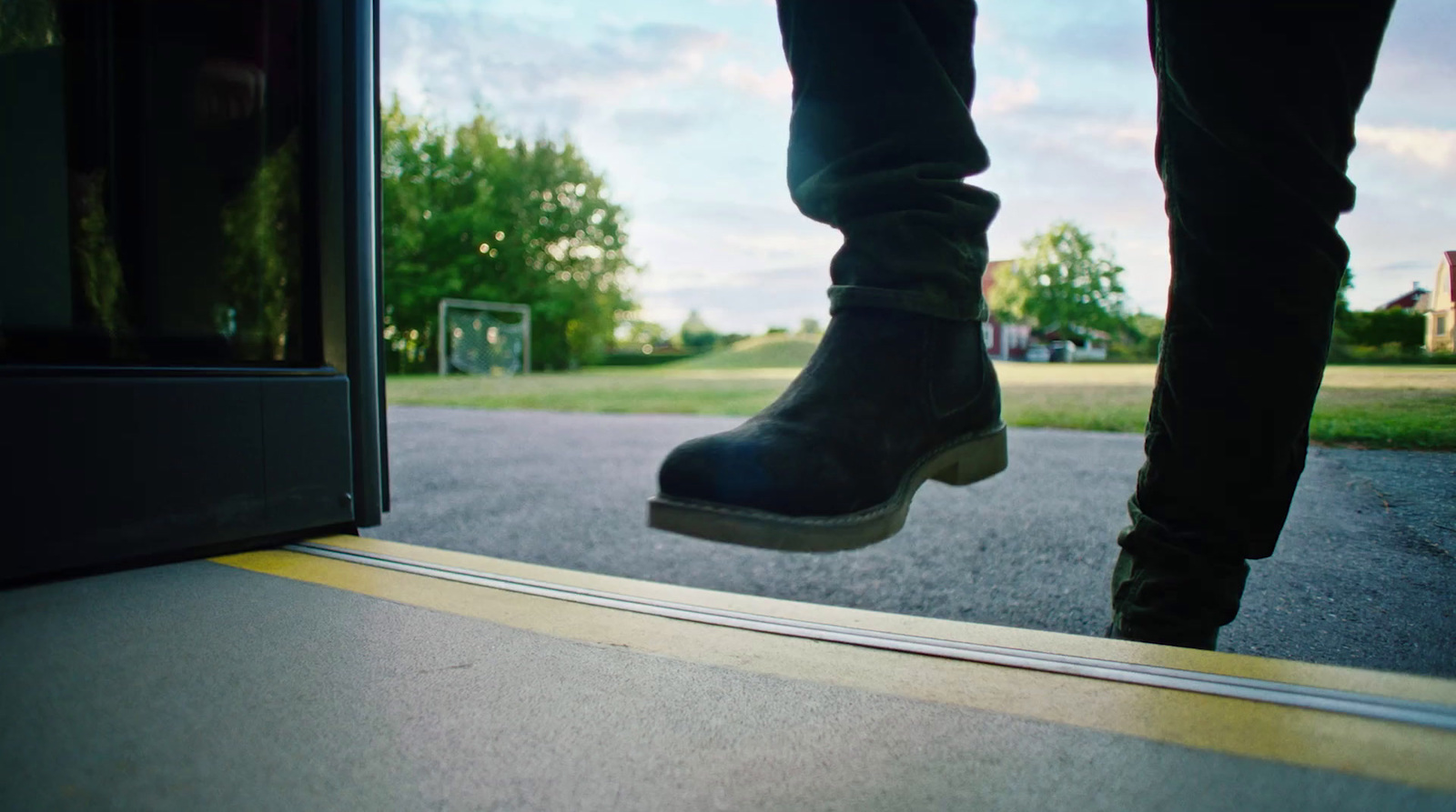 a person stepping on a ramp outside of a building