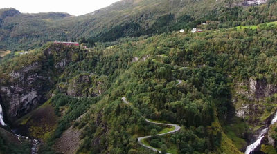 an aerial view of a waterfall in norway