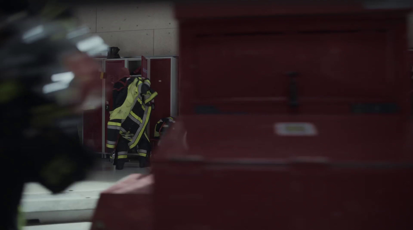 a fireman is standing in a fire station