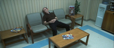 a man sitting in a chair in a room