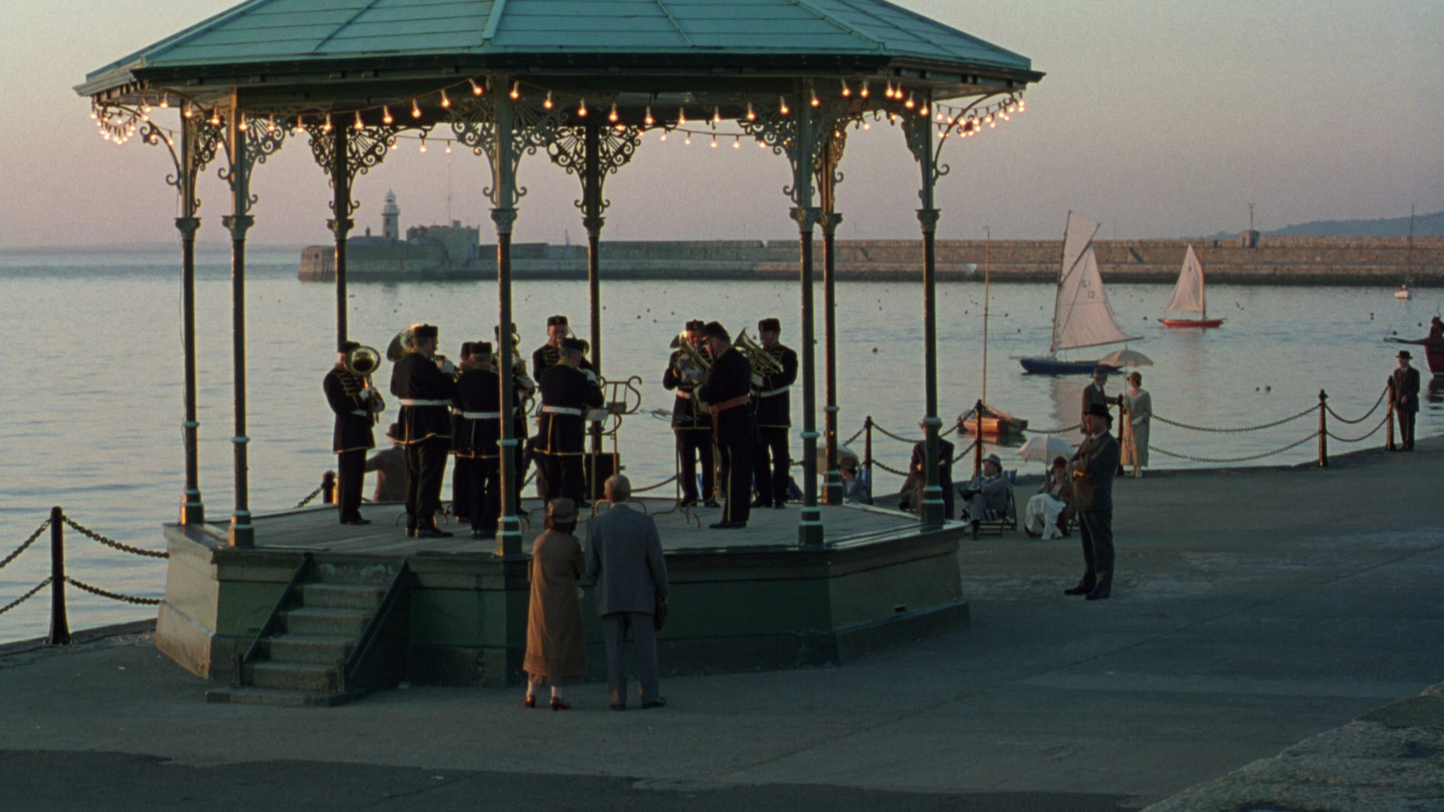 a group of people standing around a gazebo