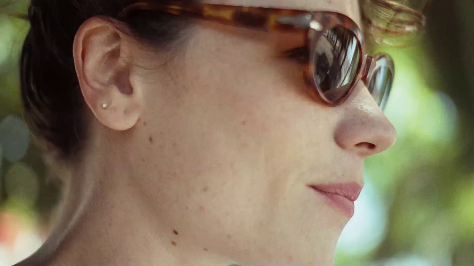 a close up of a person wearing sunglasses