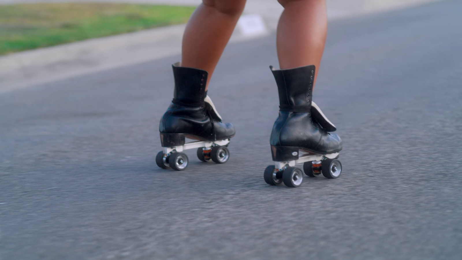 a close up of a person riding roller skates