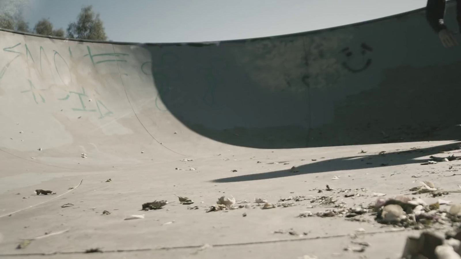 a man riding a skateboard up the side of a ramp