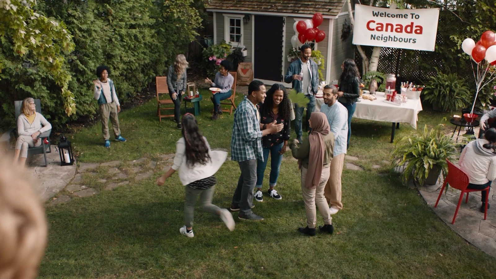 a group of people standing outside of a house