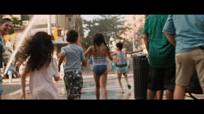 a group of people walking down a street