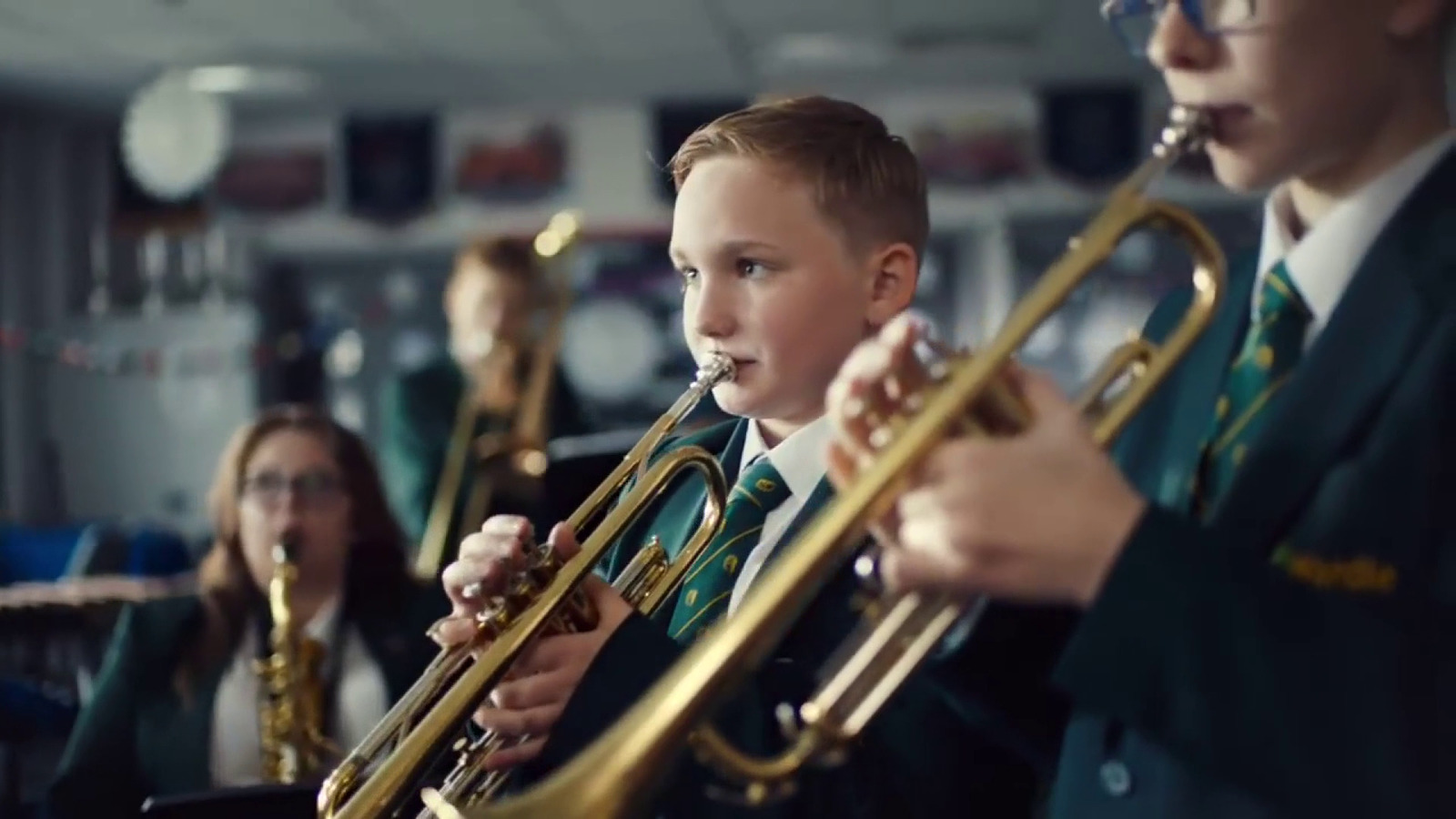 a group of young people playing musical instruments