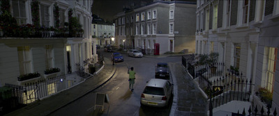 a couple of cars that are parked in the street