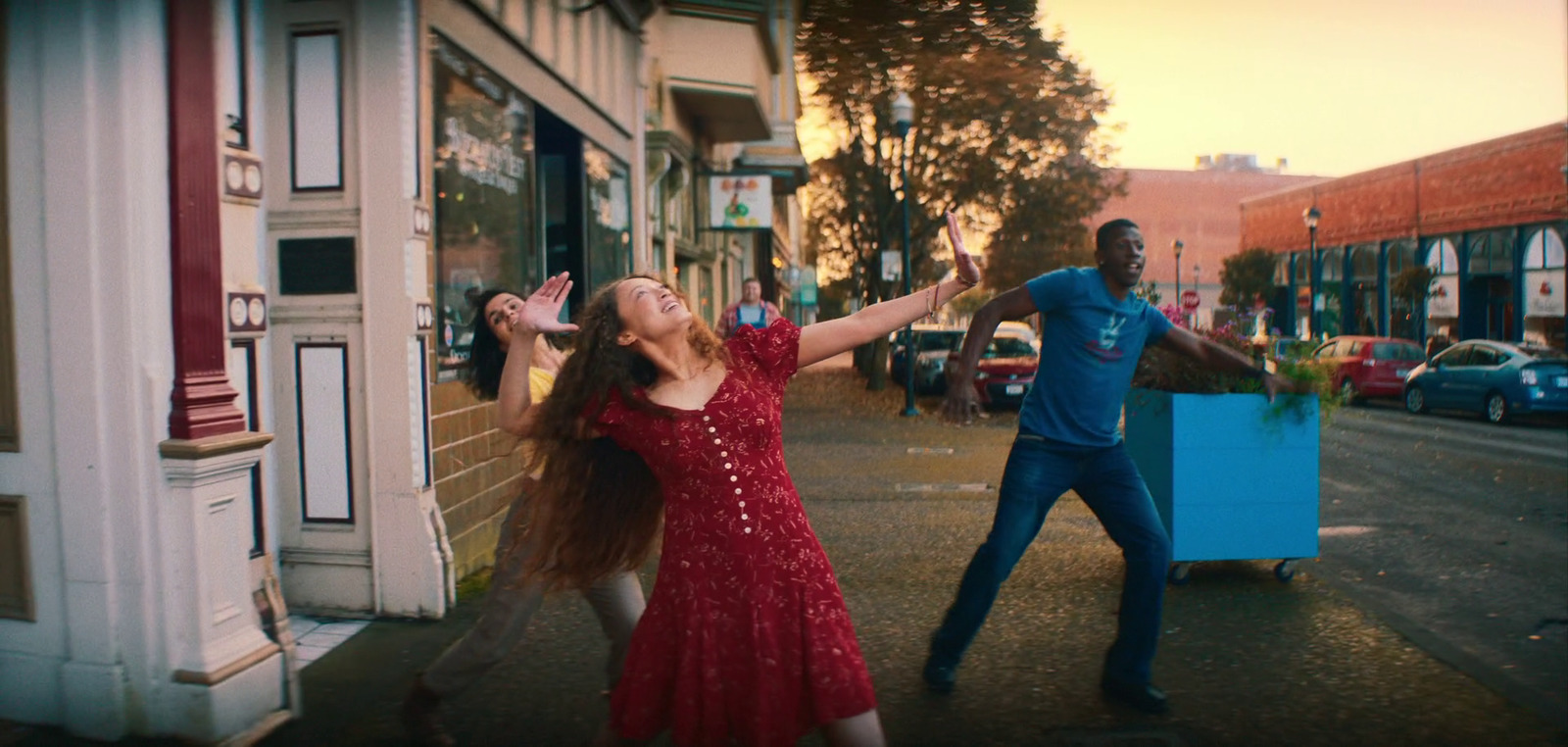 a man and a woman dancing on the street