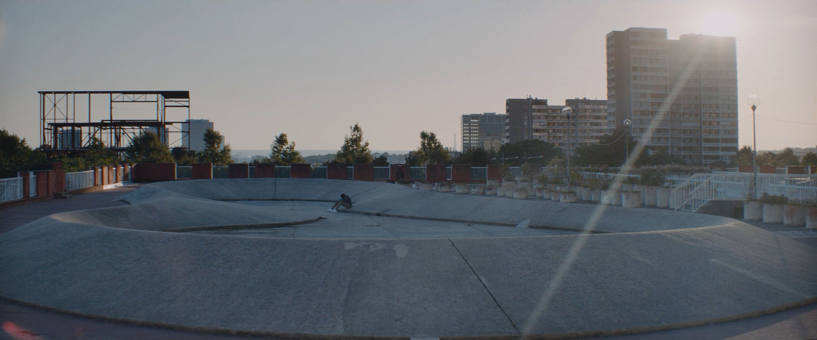 a skateboard park with a skateboard ramp in the middle of it