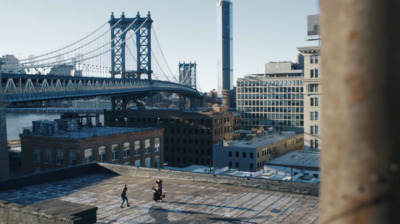 a view of a bridge over a city with tall buildings