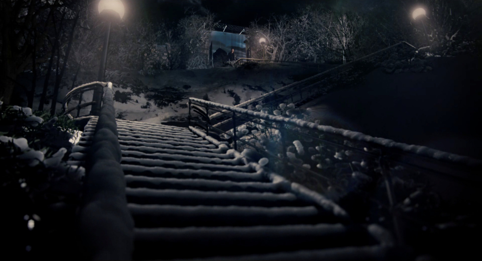 a set of stairs covered in snow at night