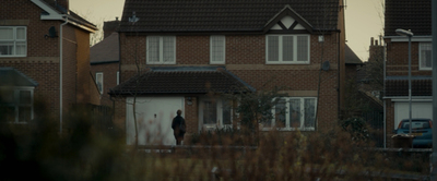 a person standing in front of a house