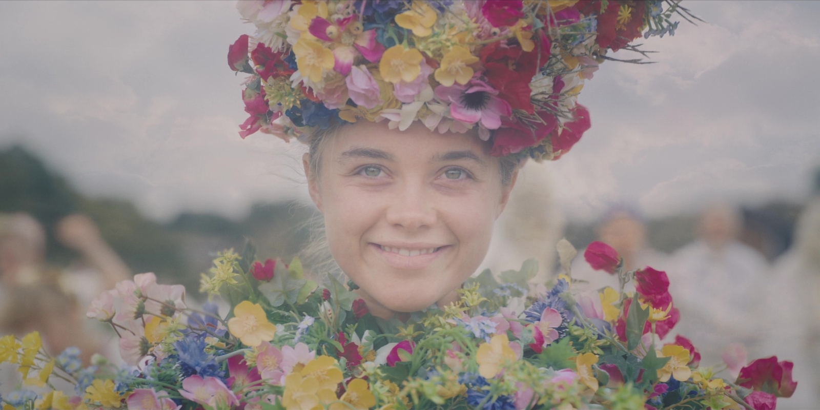 a woman with a flower crown on her head