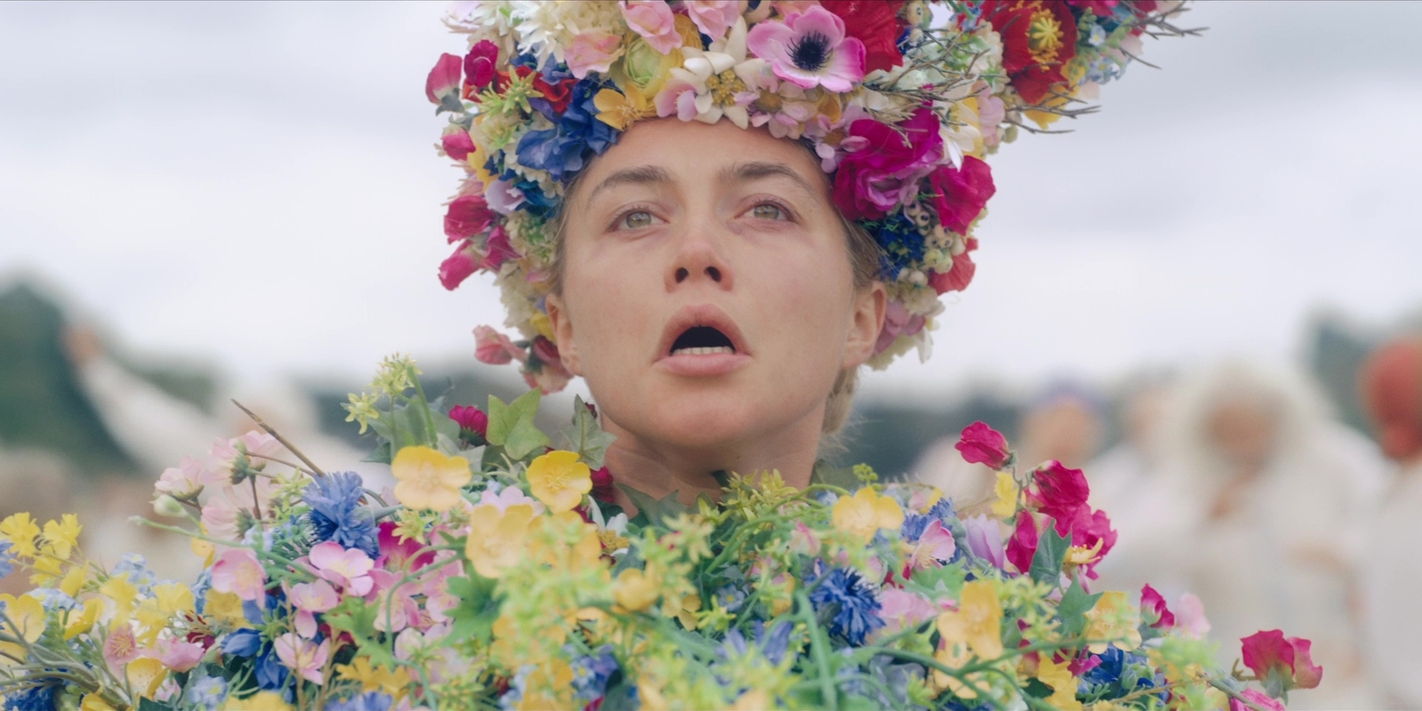 a woman with a flower crown on her head