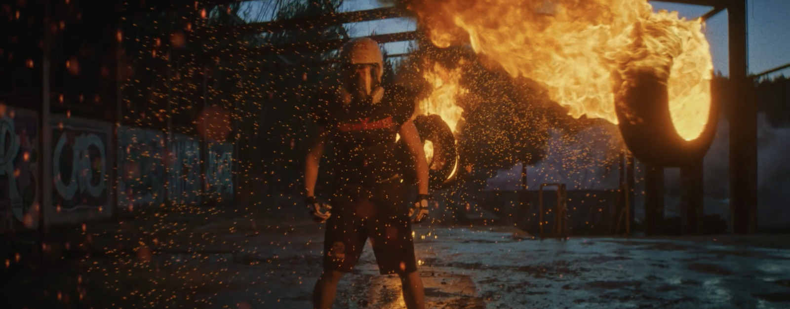 a woman standing in front of a fire