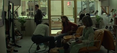 a group of people sitting in chairs in a room