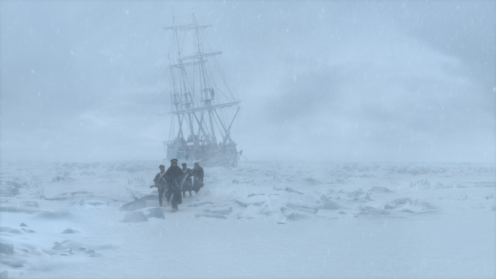 a group of people standing next to a boat in the snow