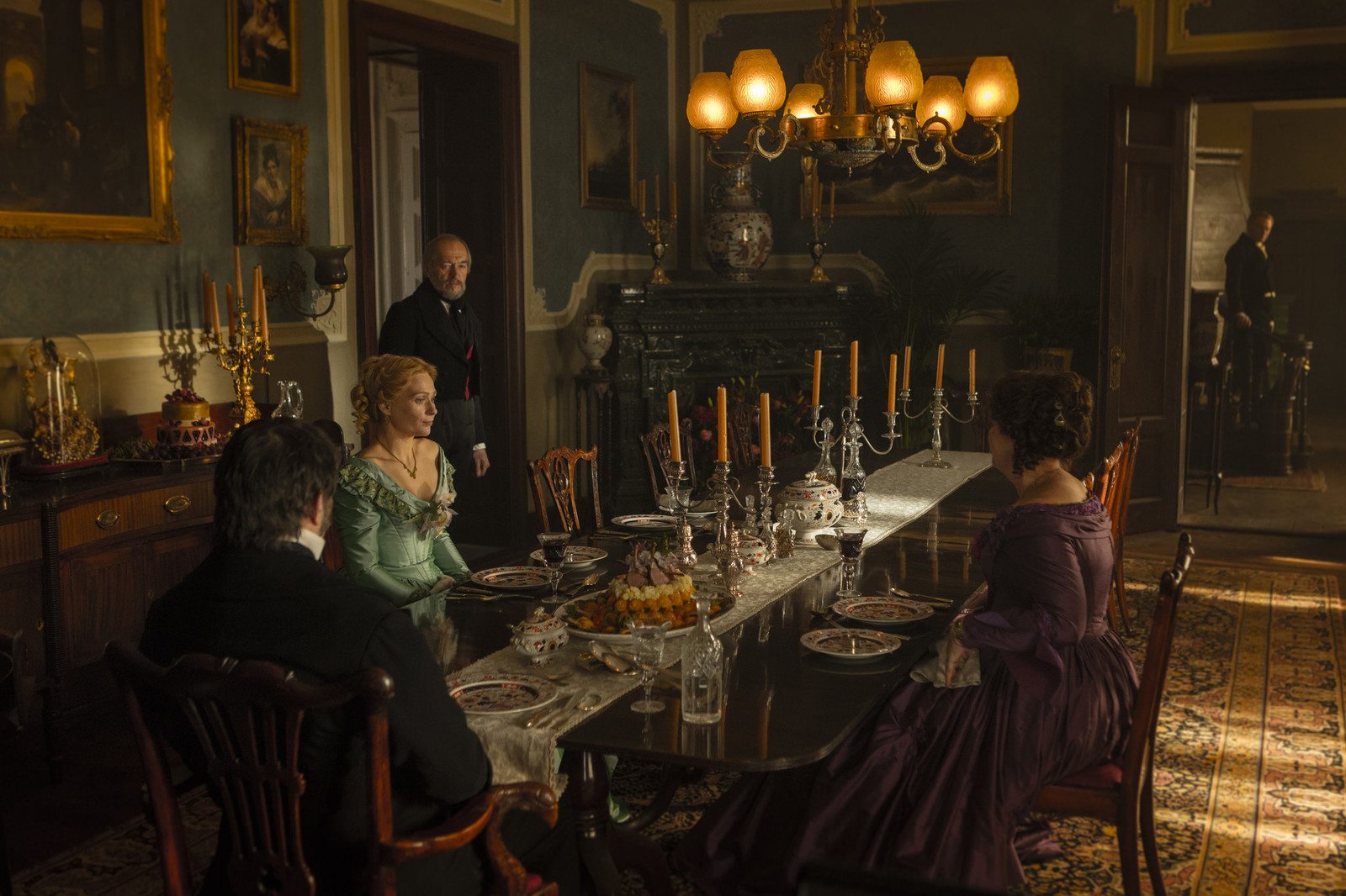 a group of people sitting around a dinner table