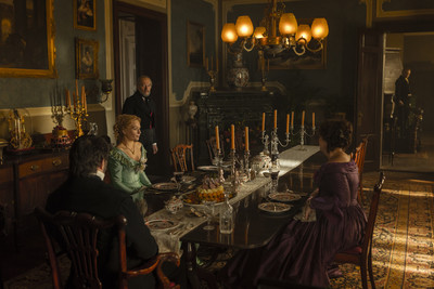 a group of people sitting around a dinner table