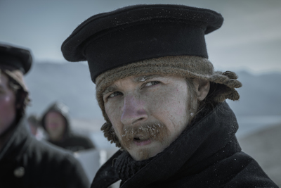 a man wearing a hat and a scarf